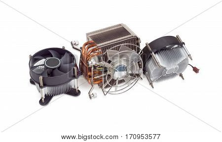 Active CPU cooler with large finned heatsink fan copper heat pipes and thermal pad two coolers with aluminum finned heatsinks and fans on a light background