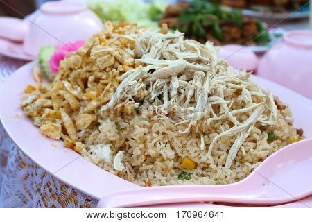 Sprinkle chicken with fried rice dish in pink.