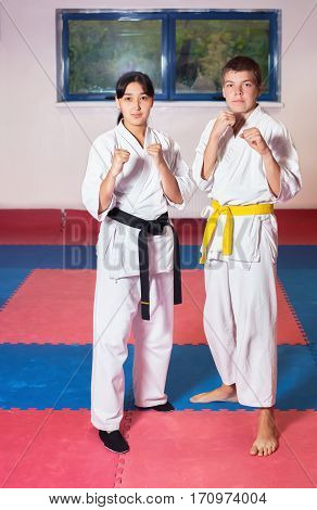 Children during training in karate. Fighting position active lifestyle practicing fighting techniques