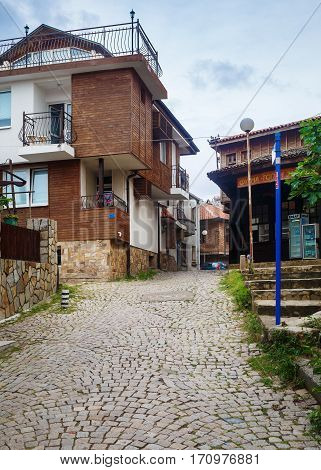 Sozopol Bulgaria - September 06 2014: Old town of Sozopol at Black Sea Bulgaria. Street ancient architecture and cobbled stone pavement. Architectural and Historic Complex. Vertical shot.