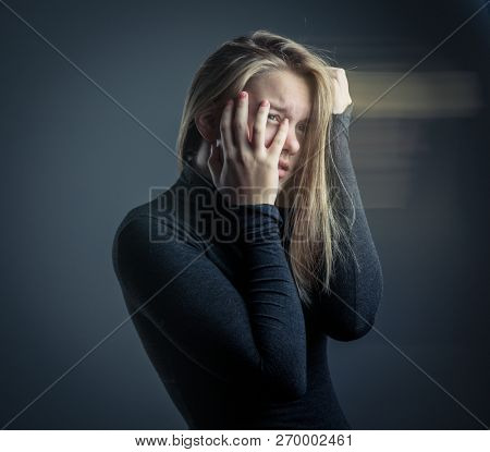 Young woman suffering from a severe depression/anxiety