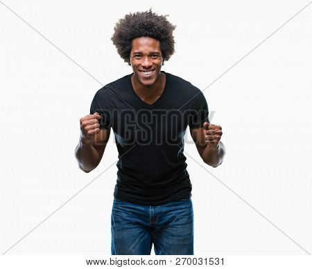 Afro american man over isolated background very happy and excited doing winner gesture with arms raised, smiling and screaming for success. Celebration concept.