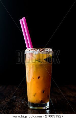 Mexican Michelada Cocktail With Beer, Lime, Ice And Spices..
