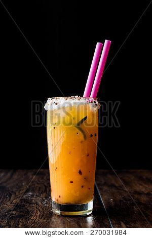 Mexican Michelada Cocktail With Beer, Lime, Ice And Spices..