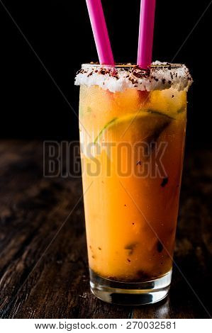 Mexican Michelada Cocktail With Beer, Lime, Ice And Spices..