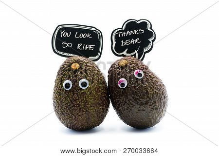 Romantic Avocados Couple With Googly Eyes And Speech Bubble As Man And Woman, Funny Food Concept For