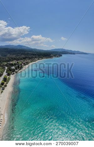 Drone Aerial View Of Sea Shore, Sandy Beach And Blue Water