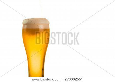 Beer Is Pouring Into Glass