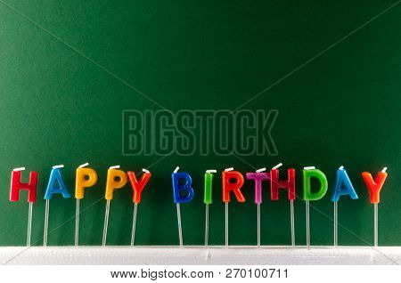 Many Colored Candles With Text Happy Birthday
