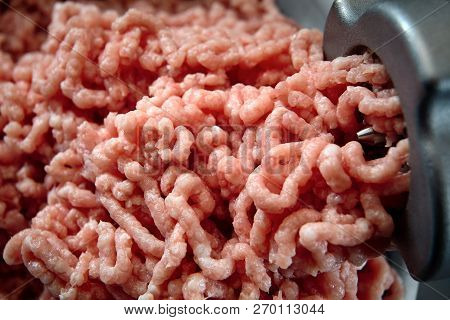 Minced Meat Coming Out From Grinder Close-up. Healthy Fresh Homemade Minced Meat Texture. Place For 