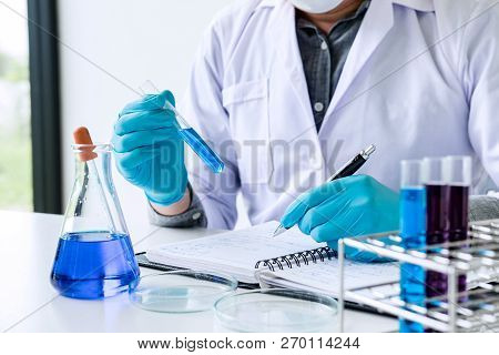 Biochemistry Laboratory Research, Scientist Or Medical In Lab Coat Holding Test Tube With Reagent Wi