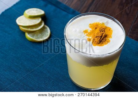 Spicy Pisco Sour Cocktail Made With Lime Juice, Egg White And Peruvian Grape Schnaps.