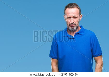 Middle age hoary senior man over isolated background depressed and worry for distress, crying angry and afraid. Sad expression.