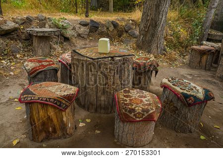 Unusual Tables And Chairs Made Of Hemp, On Top Of Traditional Cape Carpets With A Pattern. Cappadoci