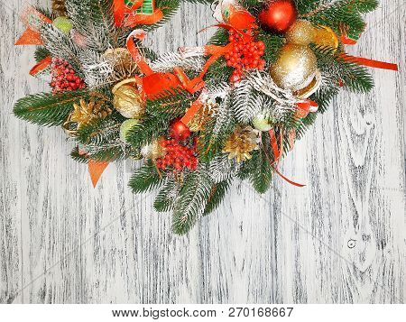 Christmas Background - Beautiful Hand Made Wreath Closeup On Vintage Wooden Background. Christmas Wr