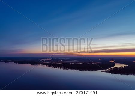 Beautiful River With Big Island With Trees Under Predawn Sky. Bright Yellow Stripe In Picturesque Cl