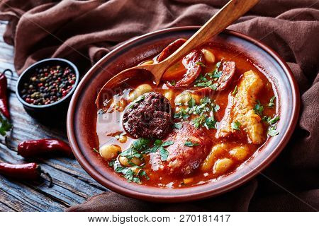 Fabada Asturiana Bean Hearty Stew In An Earthenware Bowl With Spoon On A Rustic Wooden Table With Br