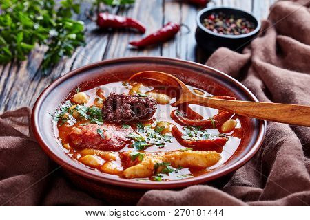 Fabada Asturiana Bean Hearty Stew In An Earthenware Bowl With Spoon On A Rustic Wooden Table With Br