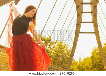Young Slim Woman With Long Brown Hair Dancing