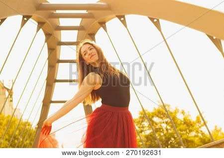 Young Slim Woman With Long Brown Hair Dancing