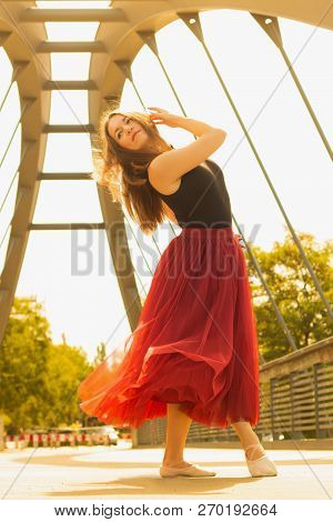 Young Slim Woman With Long Brown Hair Dancing
