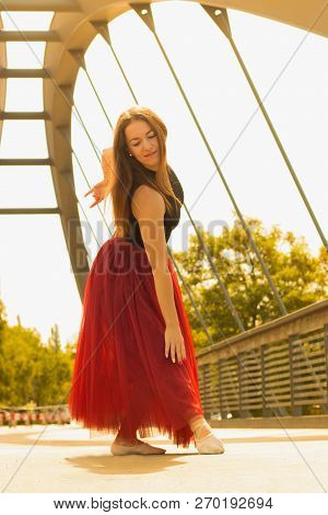 Young Slim Woman With Long Brown Hair Dancing