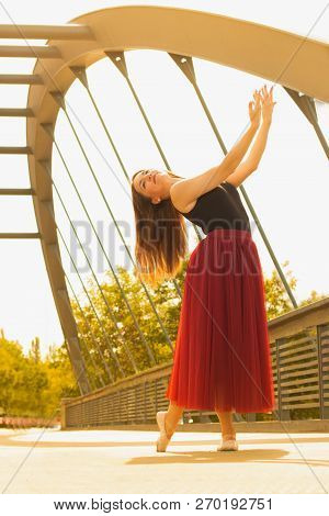 Young Slim Woman With Long Brown Hair Dancing