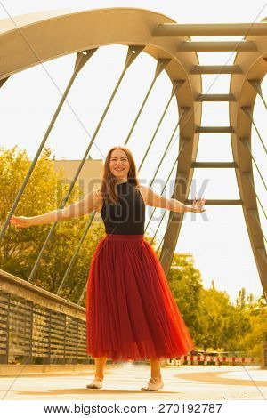 Young Slim Woman With Long Brown Hair Dancing
