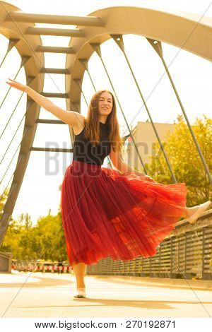 Young Slim Woman With Long Brown Hair Dancing