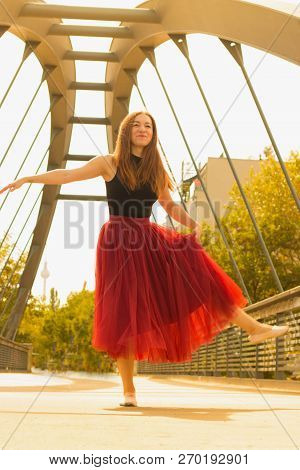Young Slim Woman With Long Brown Hair Dancing