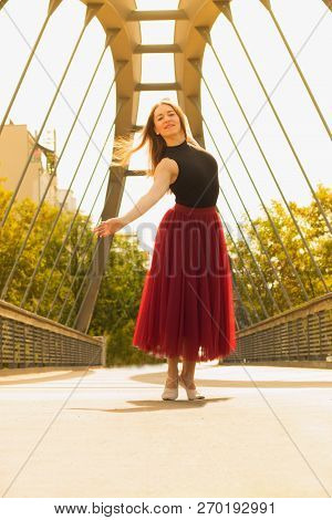 Young Slim Woman With Long Brown Hair Dancing