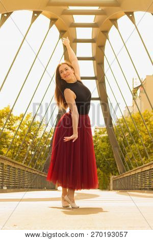Young Slim Woman With Long Brown Hair Dancing