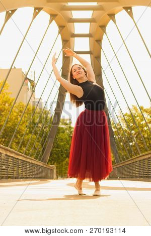 Young Slim Woman With Long Brown Hair Dancing