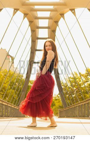Young Slim Woman With Long Brown Hair Dancing