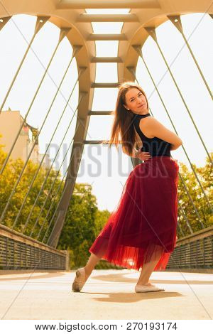 Young Slim Woman With Long Brown Hair Dancing