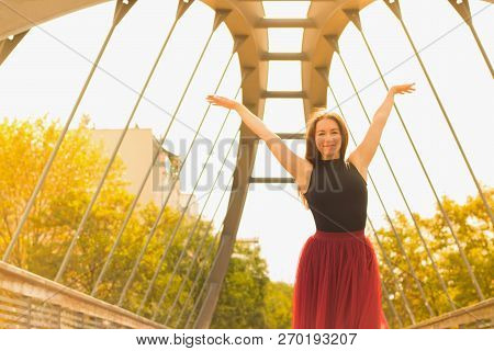 Young Slim Woman With Long Brown Hair Dancing