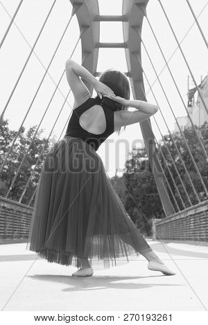 Young Slim Woman With Long Brown Hair Dancing