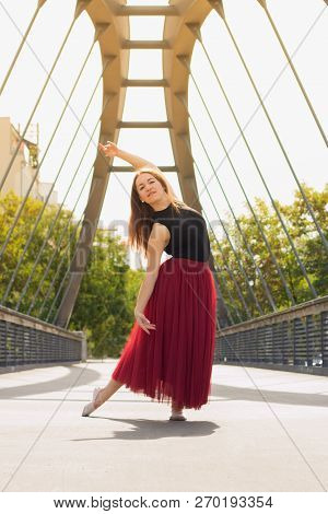 Young Slim Woman With Long Brown Hair Dancing
