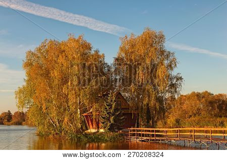 Picturesque Landscape Of Small Island With Abandoned House And Trees In The Middle Of The Lake. Autu