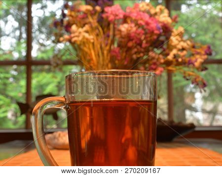 A Cup Of Hot Tea At The Table.