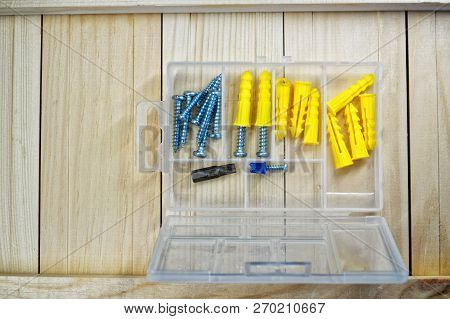 Screws And Dowels Lie On The Boards. Box-organizer For The Carpenter. Locksmith Work With Wood.