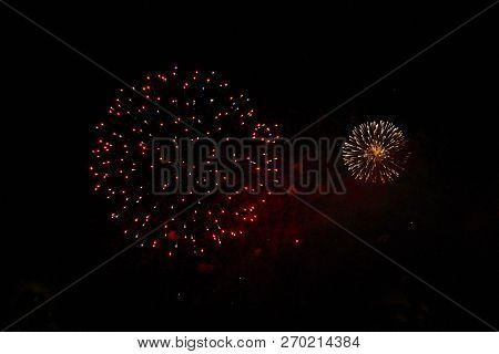 The Celebration Round Colored Firework Flashing In The Black Night Sky