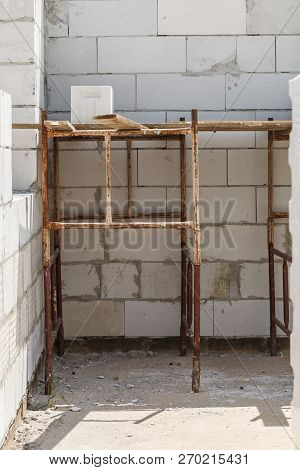 Details Of House Home Construction Site. Provisional Walls Made Of Grey Blocks.