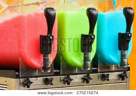 Close Up Of Slush Machine. Slushy Ice Made Colorful Drink Refreshing During Summer