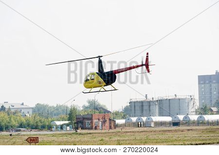 Tyumen, Russia - August 11, 2012: On A Visit At Utair Airshow In Heliport Plehanovo. Pilot Of Robins