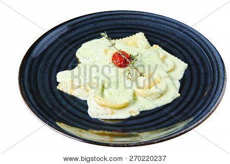 Ravioli With Salmon In Creamy Sauce With Pesto Isolated On White