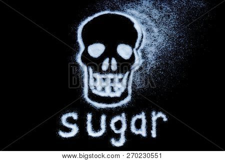 Danger Of Sugar. Harm White Sugar Concept Forming A Skull. Isolated On A Black Background. Stock Ima