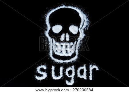 Harm White Sugar Forming A Skull. With Text Sugar Isolated On A Black Background.