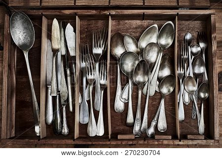 A Vintage Service Cutlery Inside A Rustic Wooden Box.