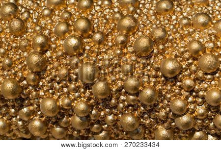 Balls Of Golden Color Of Different Size Closeup. Bright Gold Shiny Background. Stock Image.